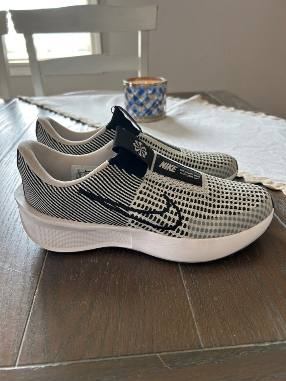 Nike Women’s Black and White Slip-On Athletic Shoes